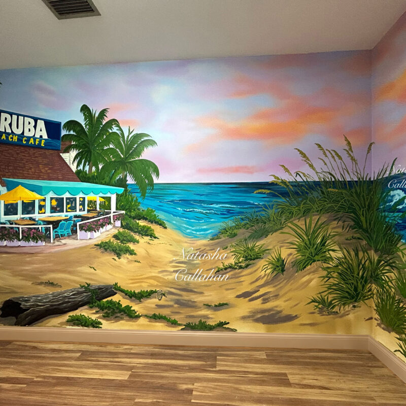 Beach cafe mural with palm trees and ocean waves.
